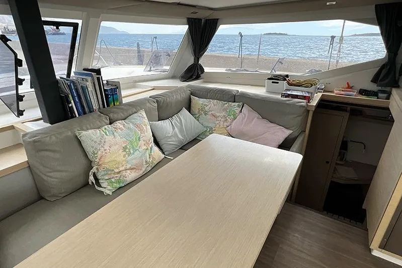  Yacht Photos Pics 2018 Fountaine Pajot Lucia 40 interior with cozy seating and ocean view.