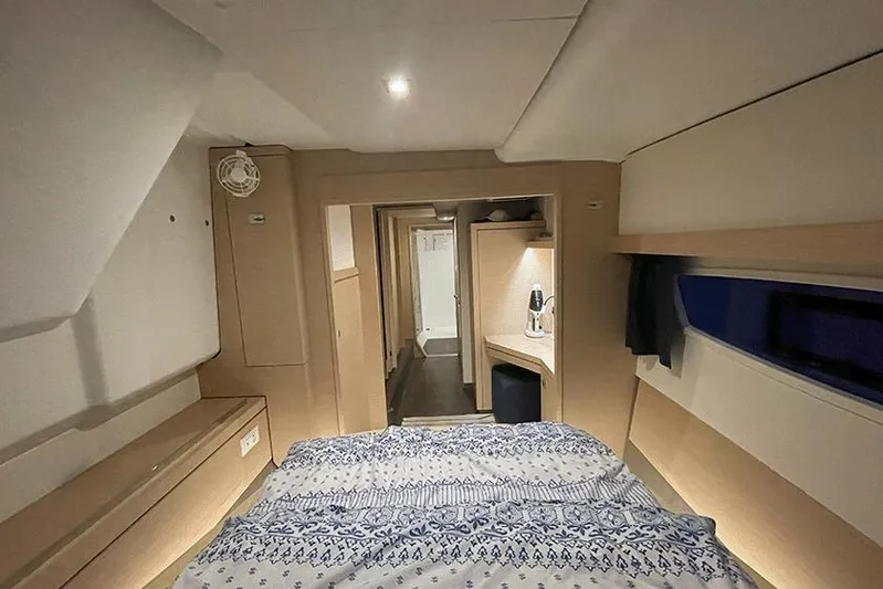  Yacht Photos Pics Interior of 2018 Fountaine Pajot Lucia 40 catamaran, featuring cozy bedroom and modern design.