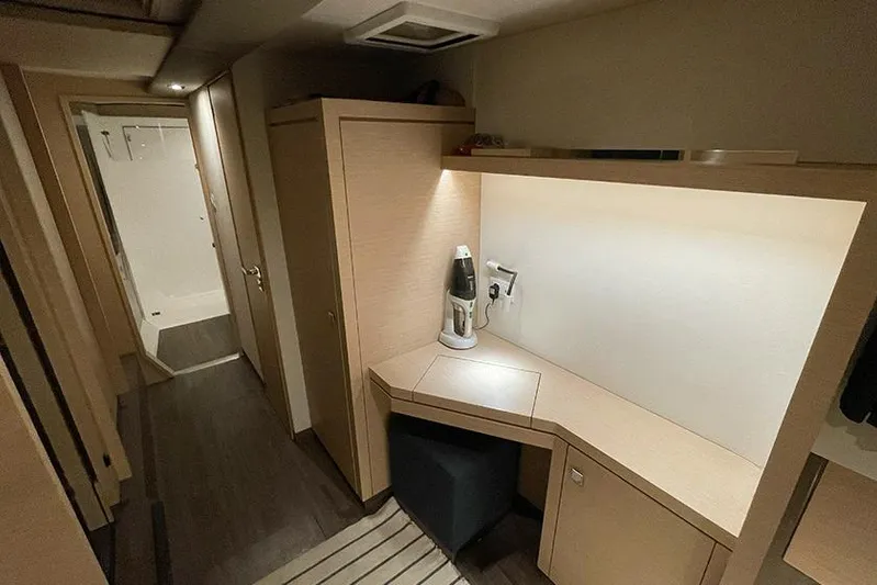  Yacht Photos Pics Interior of 2018 Fountaine Pajot Lucia 40 catamaran, featuring a modern desk and hallway.