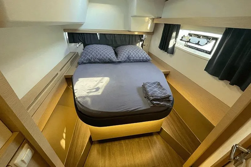  Yacht Photos Pics Luxurious cabin interior of 2018 Fountaine Pajot Lucia 40 catamaran with cozy bed and modern design.