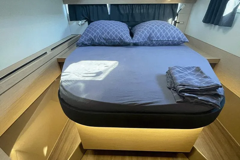  Yacht Photos Pics Luxurious cabin interior of 2018 Fountaine Pajot Lucia 40 catamaran with cozy bedding.