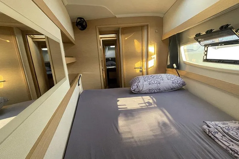  Yacht Photos Pics Cozy cabin interior of 2018 Fountaine Pajot Lucia 40 catamaran with sunlight and modern design.