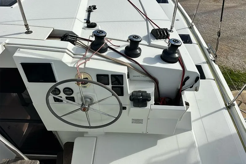  Yacht Photos Pics Helm station of 2018 Fountaine Pajot Lucia 40 catamaran with steering wheel and winches.