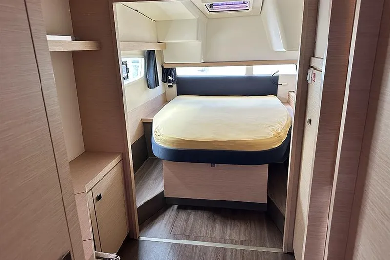 Yacht Photos Pics 2018 Fountaine Pajot Lucia 40 cabin interior with bed, wood finish, and natural light.