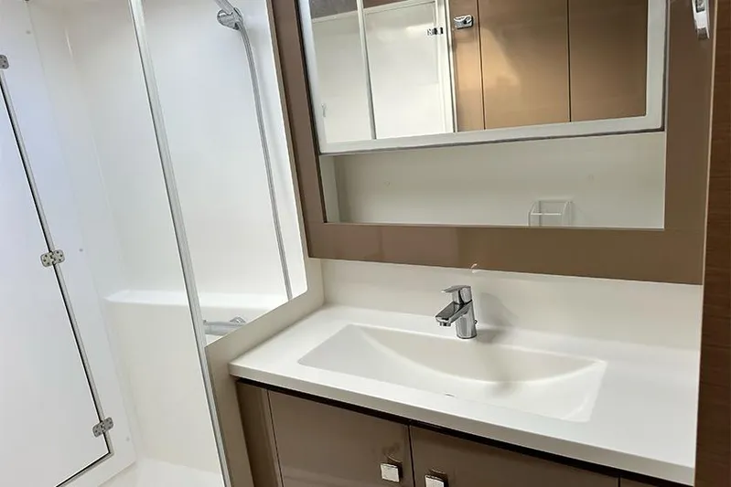  Yacht Photos Pics Modern bathroom in 2018 Fountaine Pajot Lucia 40 catamaran with sleek sink and mirror.