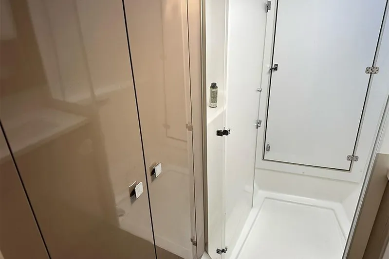  Yacht Photos Pics Bathroom interior of 2018 Fountaine Pajot Lucia 40 catamaran, featuring modern shower design.