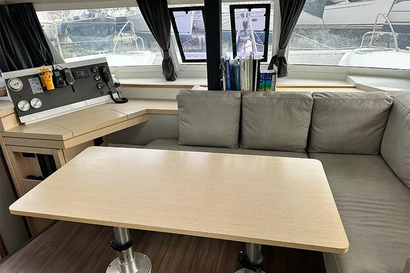  Yacht Photos Pics Interior of 2018 Fountaine Pajot Lucia 40 catamaran with cozy seating and navigation area.