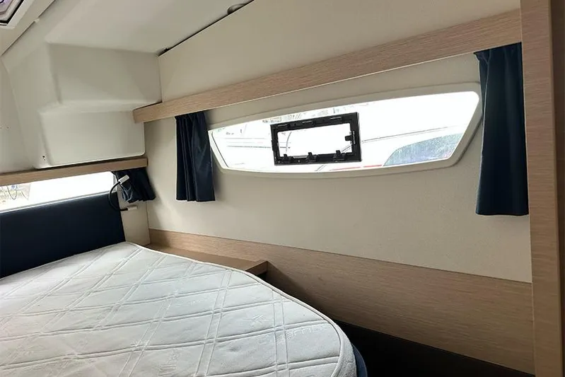  Yacht Photos Pics Interior cabin of 2018 Fountaine Pajot Lucia 40 catamaran with bed and window.