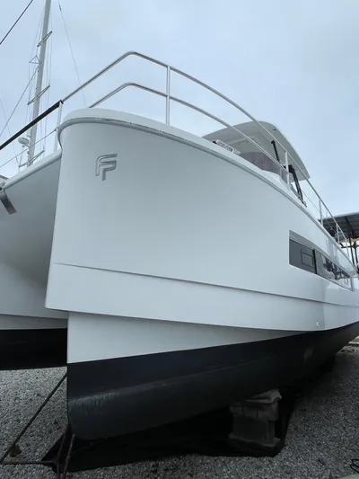  Yacht Photos Pics 2018 Fountaine Pajot MY 37 yacht on dry dock, side view.