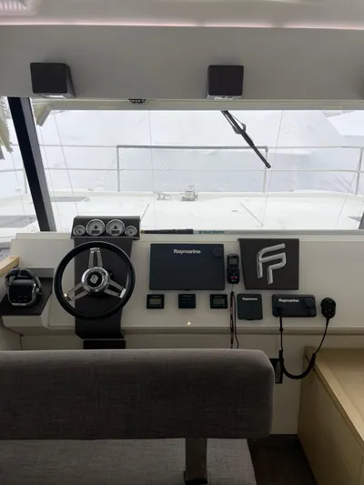  Yacht Photos Pics Helm of 2018 Fountaine Pajot MY 37 yacht with steering wheel and navigation controls.