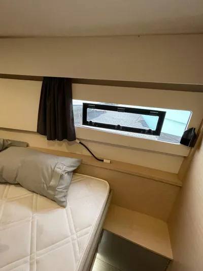  Yacht Photos Pics 2018 Fountaine Pajot MY 37 cabin interior with bed, window, and curtain.