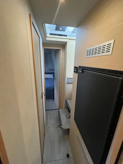  Yacht Photos Pics Interior hallway of 2018 Fountaine Pajot MY 37 yacht, featuring modern design and compact layout.