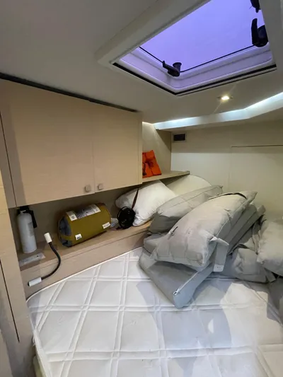  Yacht Photos Pics Cozy cabin interior of 2018 Fountaine Pajot MY 37 with skylight and storage.