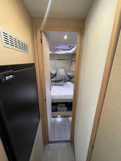  Yacht Photos Pics Cabin interior of 2018 Fountaine Pajot MY 37 yacht, featuring a cozy bed and modern design.
