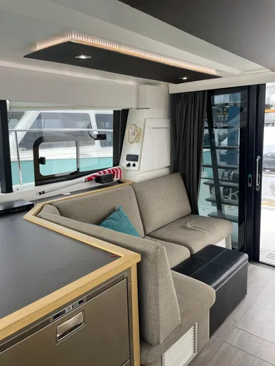  Yacht Photos Pics Interior of 2018 Fountaine Pajot MY 37 yacht with modern seating and large windows.