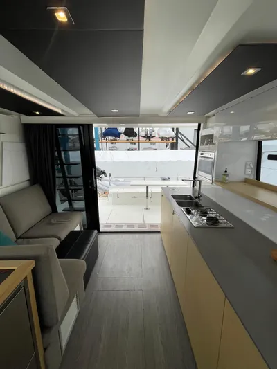  Yacht Photos Pics Interior of 2018 Fountaine Pajot MY 37 yacht, featuring modern kitchen and seating area.