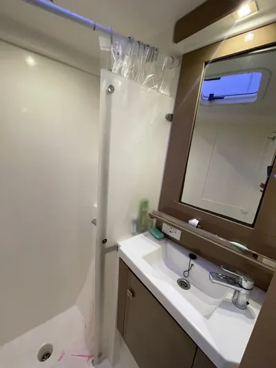  Yacht Photos Pics Bathroom interior of 2018 Fountaine Pajot MY 37 yacht with shower and sink.