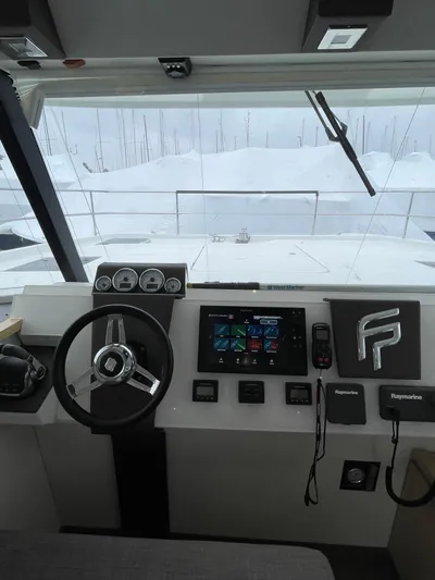  Yacht Photos Pics 2018 Fountaine Pajot MY 37 helm with modern controls and navigation equipment.