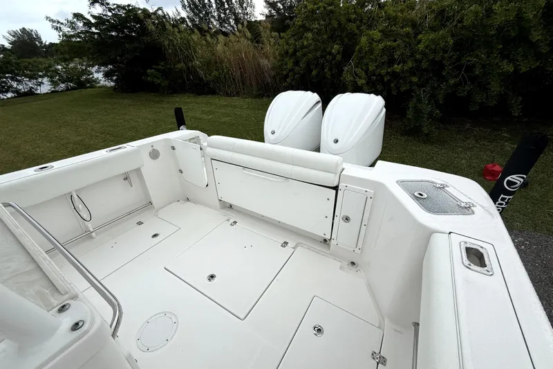  Yacht Photos Pics 2023 Edgewater 285CC boat interior with dual engines, spacious deck, and sleek design.