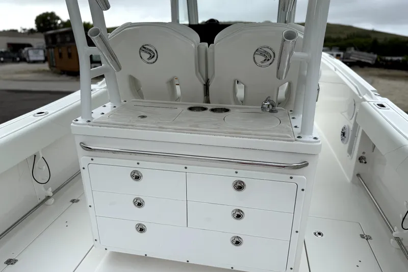  Yacht Photos Pics 2023 Edgewater 285CC boat interior with storage drawers and seating.