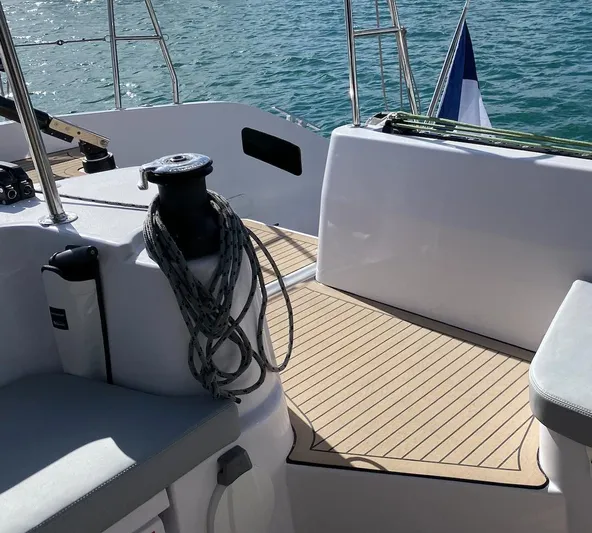 Peems Yacht Photos Pics Outremer 45 sailboat deck, 2022 model, with winch and seating, on calm water.