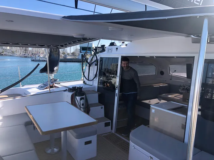 Peems Yacht Photos Pics Outremer 45 catamaran 2022, spacious deck and seating area, docked at marina.