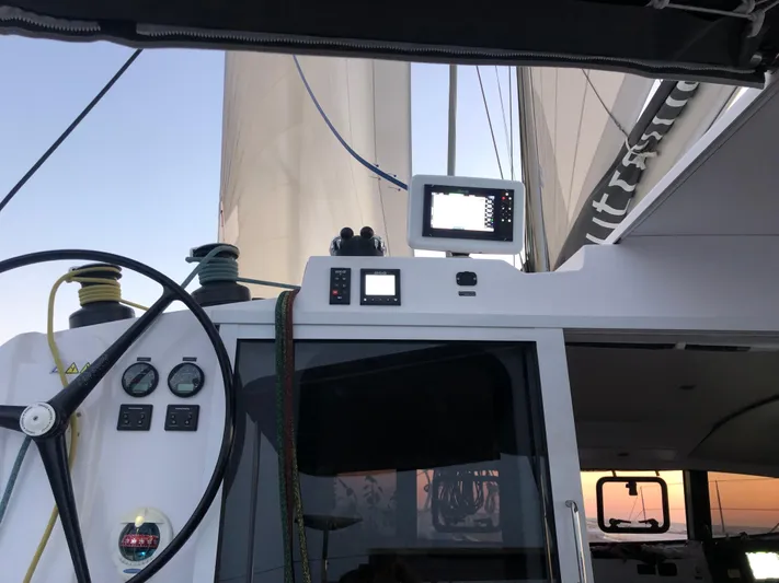 Peems Yacht Photos Pics Cockpit view of 2022 Outremer 45 sailboat with navigation instruments and sails.