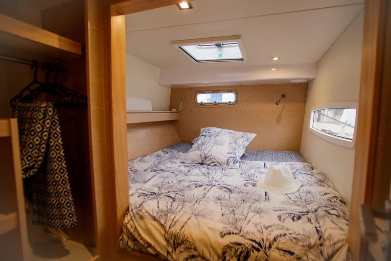 Peems Yacht Photos Pics Cozy bedroom in 2022 Outremer 45 yacht with patterned bedding and natural light.