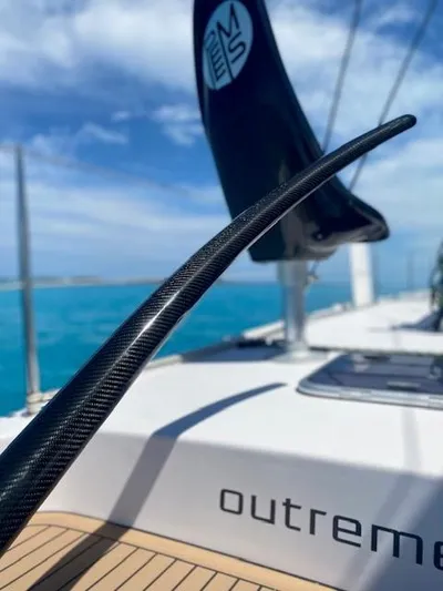 Peems Yacht Photos Pics Outremer 45 catamaran deck, 2022 model, with sleek design and ocean backdrop.