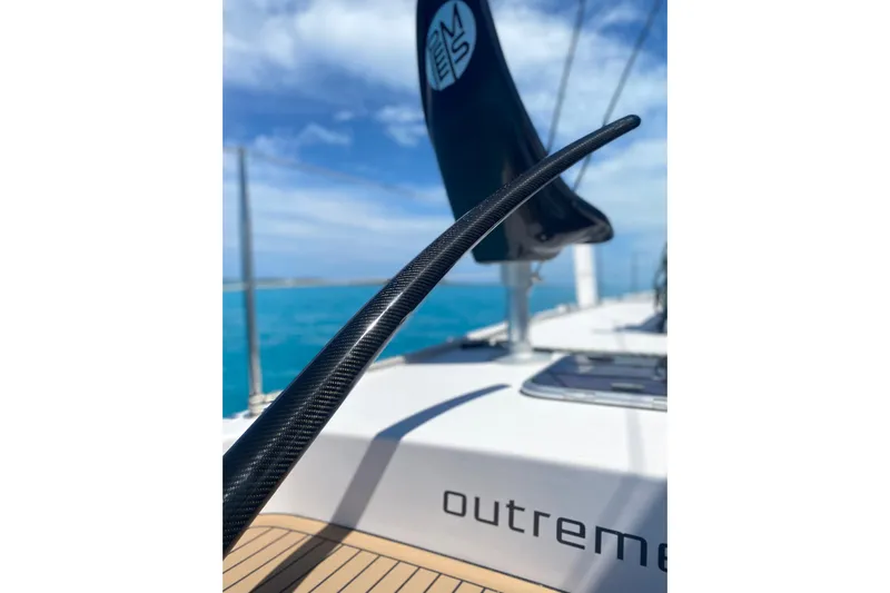 Peems Yacht Photos Pics Outremer 45 catamaran deck view, showcasing sleek design and ocean backdrop, 2022 model.