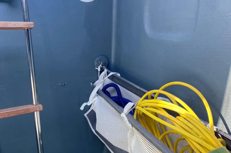 Peems Yacht Photos Pics Storage area on a 2022 Outremer 45 boat with ropes and cables.