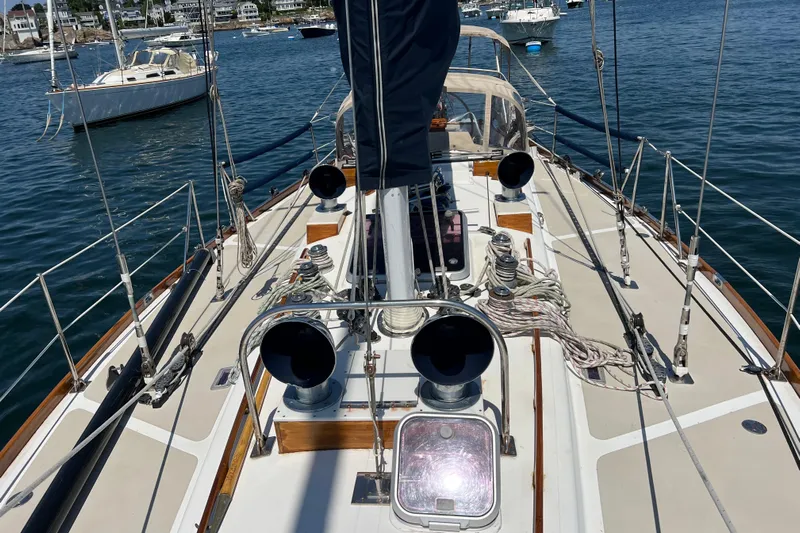 Courage Yacht Photos Pics 1980 Hinckley 43 sailboat deck with ropes and winches in a marina setting.