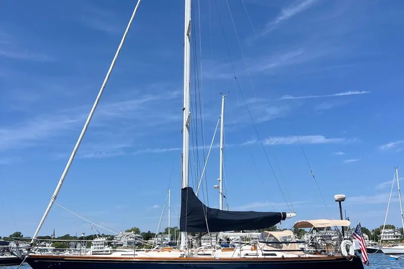 Courage Yacht Photos Pics 1980 Hinckley 43 sailboat docked under clear blue sky.