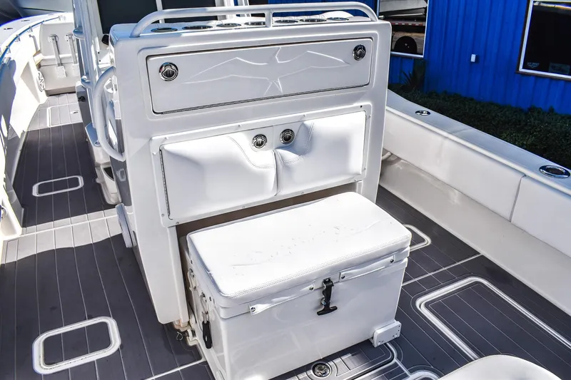  Yacht Photos Pics 2022 Invincible 33 Open Fisherman boat interior with seating and storage compartments.