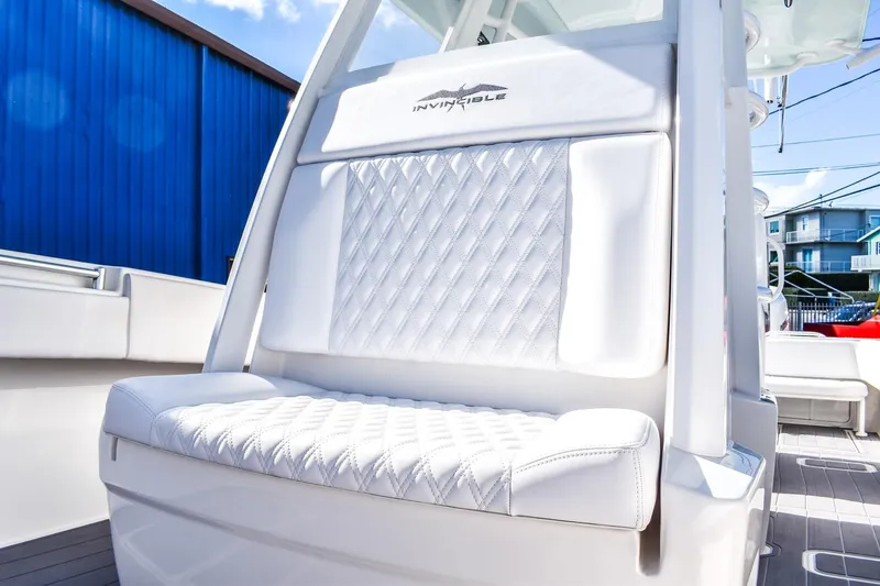  Yacht Photos Pics 2022 Invincible 33 Open Fisherman boat with luxurious white seating and modern design.