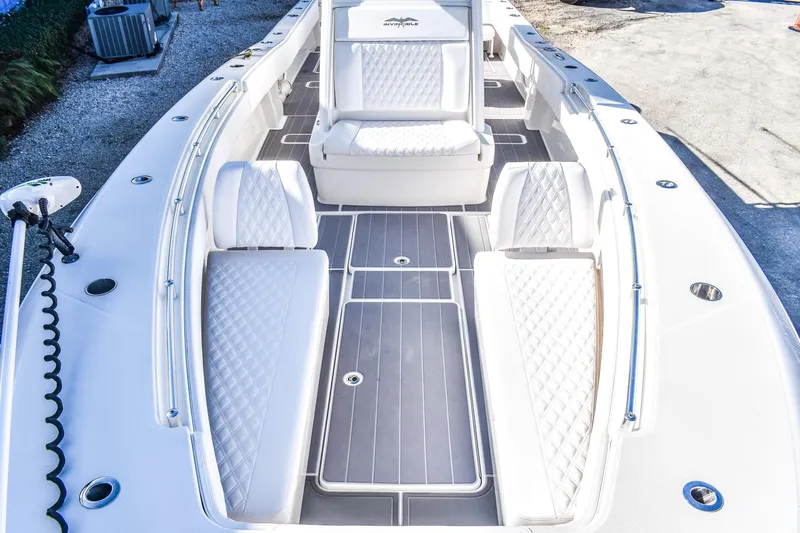  Yacht Photos Pics 2022 Invincible 33 Open Fisherman boat interior with white seating and sleek design.
