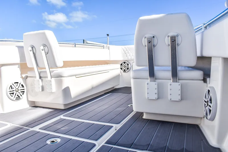  Yacht Photos Pics 2022 Invincible 33 Open Fisherman boat interior with white seating and speakers.