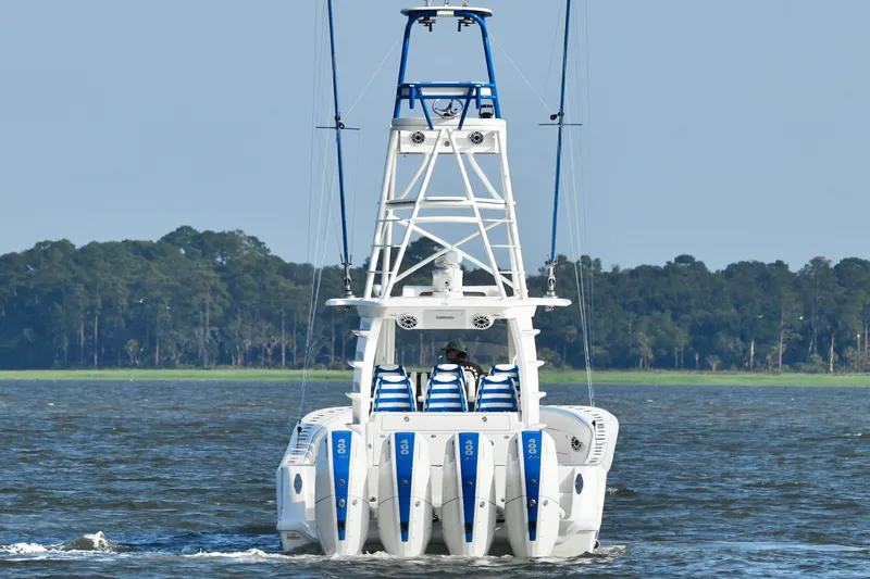  Yacht Photos Pics 2024 SeaVee 420Z boat with four engines cruising on a lake.