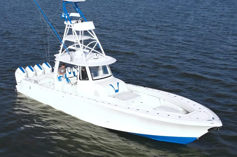  Yacht Photos Pics 2024 SeaVee 420Z boat on open water, featuring multiple outboard engines.