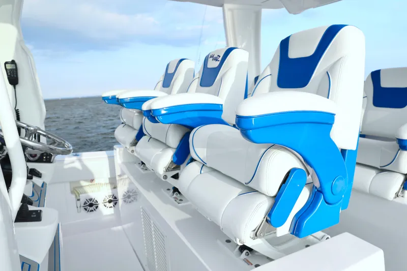  Yacht Photos Pics 2024 SeaVee 420Z boat interior with blue and white seating, ocean view.