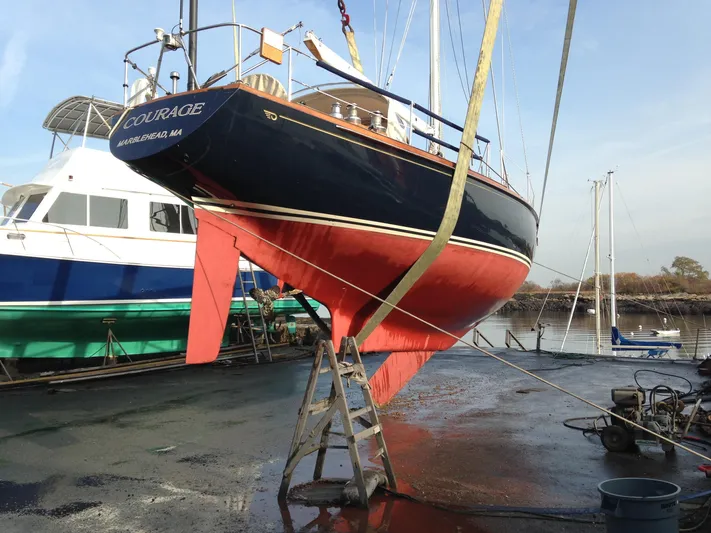 Courage Yacht Photos Pics Hinckley 43 sailboat from 1980, elevated for maintenance at a marina.