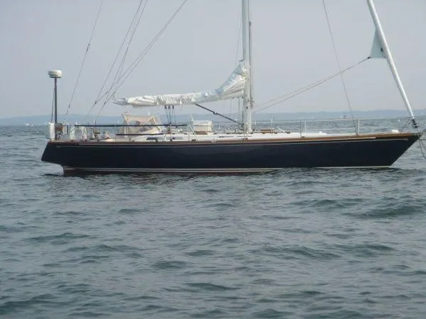 Courage Yacht Photos Pics 1980 Hinckley 43 sailboat on open water, side view.