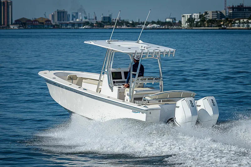  Yacht Photos Pics 2020 Birdsall 30 CC boat cruising on calm water with city skyline in background.