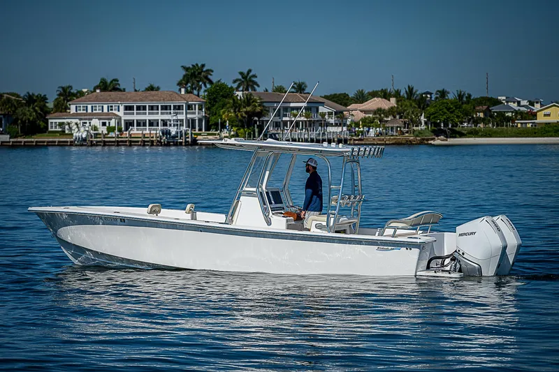  Yacht Photos Pics 2020 Birdsall 30 CC boat cruising on calm water near waterfront homes.