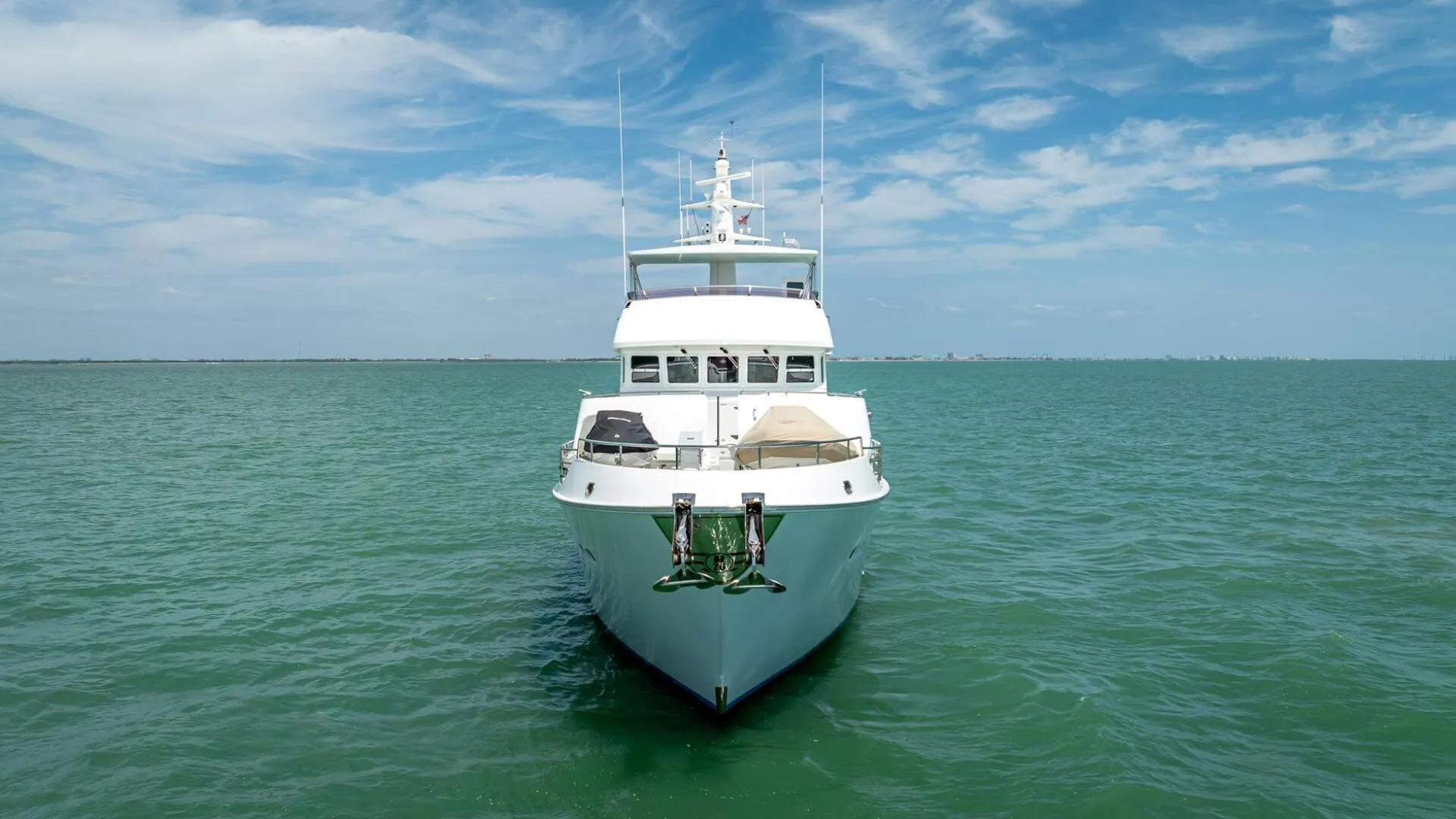 Nordhavn 76 yacht from 2009 on open sea under blue sky.