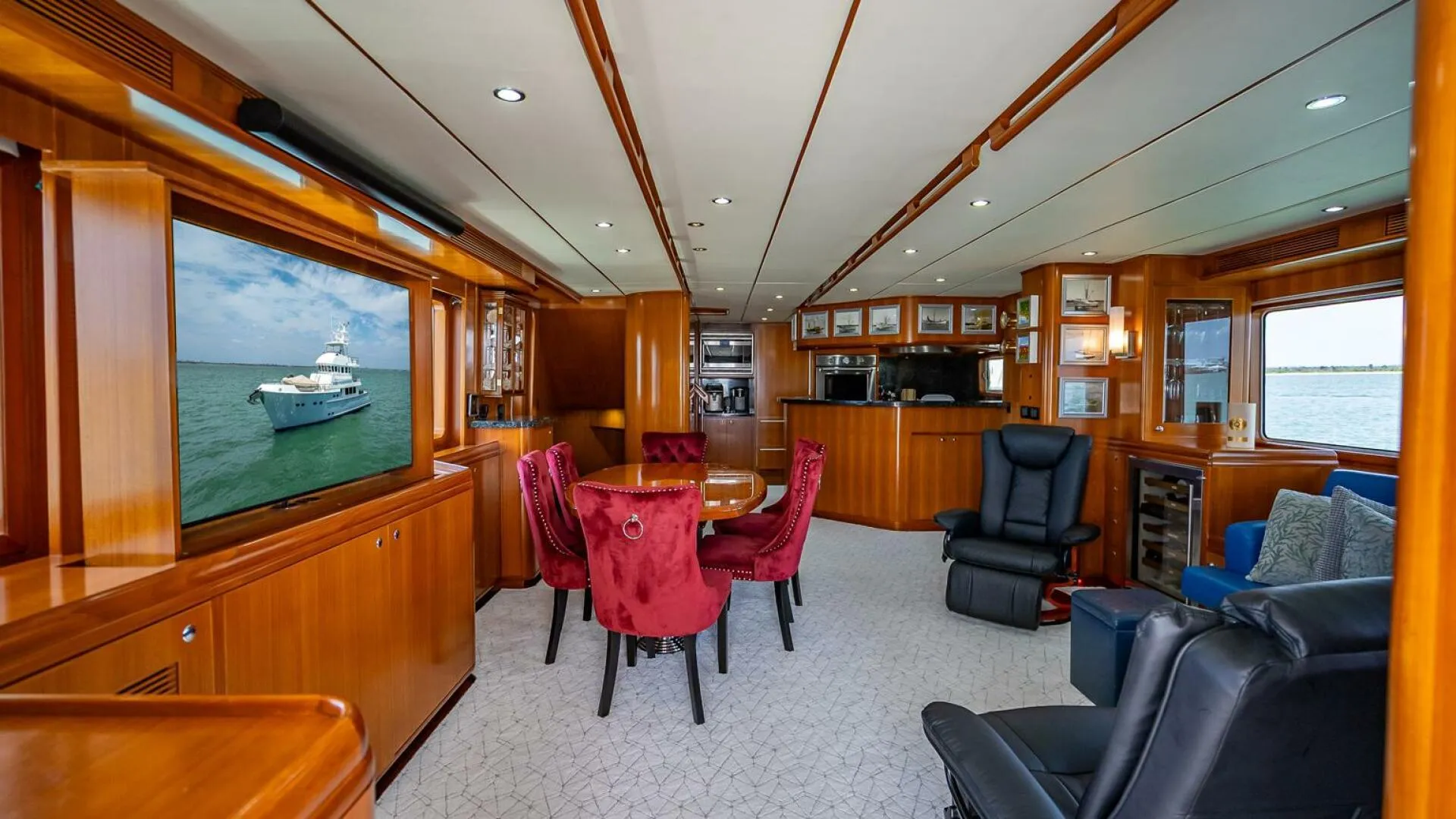 Luxurious interior of 2009 Nordhavn 76 yacht with elegant wood finishes and plush seating.
