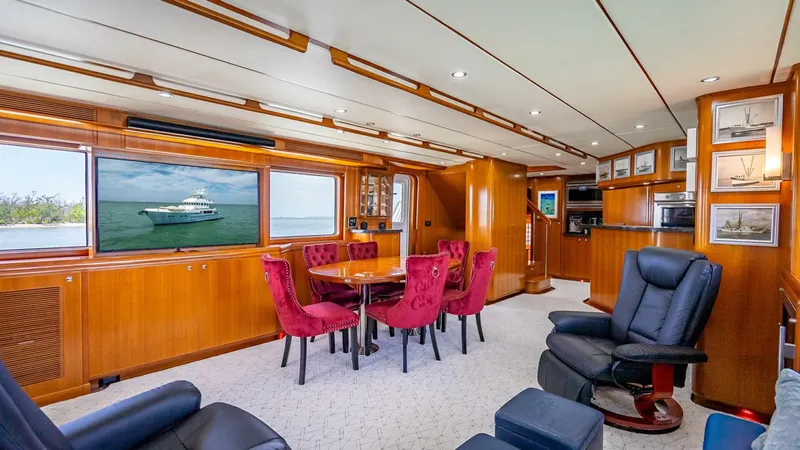 Take 5 Yacht Photos Pics Luxurious interior of 2009 Nordhavn 76 yacht with elegant seating and wood paneling.