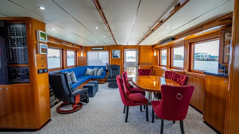 Take 5 Yacht Photos Pics Luxurious interior of 2009 Nordhavn 76 yacht with elegant seating and dining area.