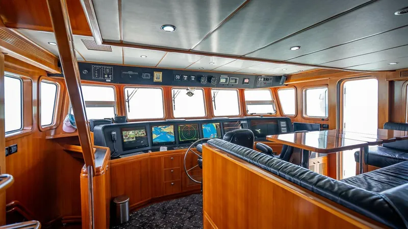 Take 5 Yacht Photos Pics Luxurious 2009 Nordhavn 76 yacht interior with navigation equipment and wooden finishes.