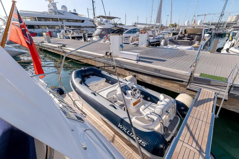  Yacht Photos Pics 2014 Princess 72 Motor Yacht docked with tender boat in marina.